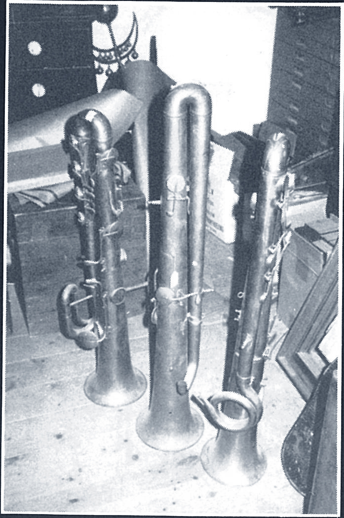 Three ophicleides await restoration.