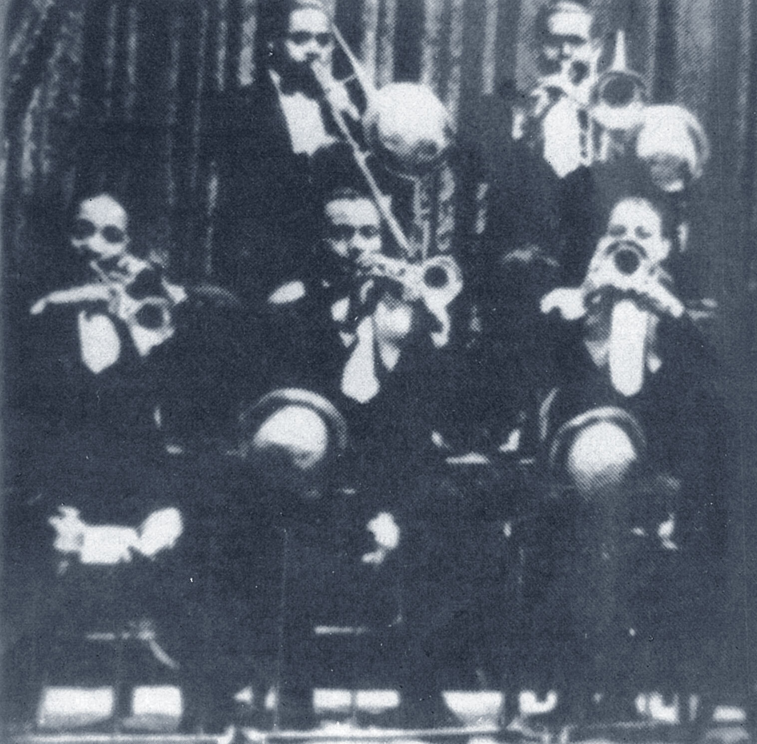 Brass section of Duke Ellington’s orchestra around 1929.➜ Freddy Jenkins (tp, playing left hand), Joe Nanton † (tbl), Co...